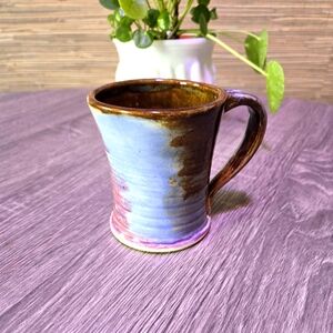 Handmade multi color pottery mug.